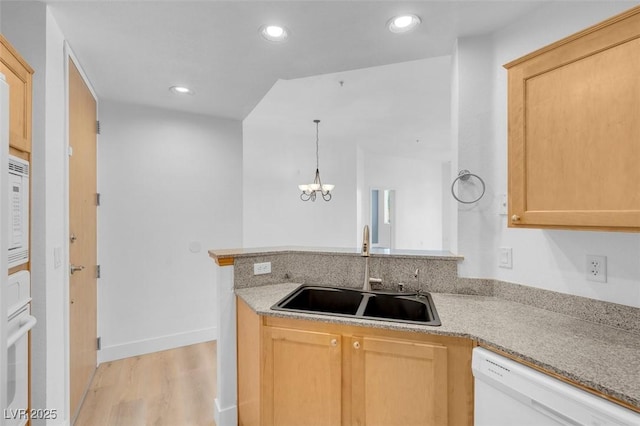 75 E Agate Ave Unit 206, Las Vegas, NV 89123 - kitchen with white dishwasher, a peninsula, light wood-style flooring, a chandelier, and recessed lighting