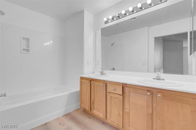 75 E Agate Ave Unit 206, Las Vegas, NV 89123 - bathroom with wood finished floors, double vanity, and shower / bath combination