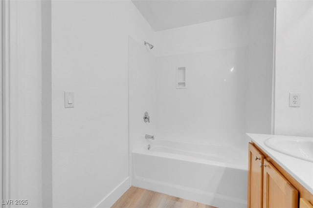 75 E Agate Ave Unit 206, Las Vegas, NV 89123 - bathroom featuring vanity, bathtub / shower combination, and wood finished floors