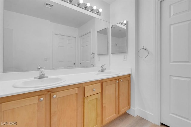 75 E Agate Ave Unit 206, Las Vegas, NV 89123 - bathroom with double vanity and wood finished floors