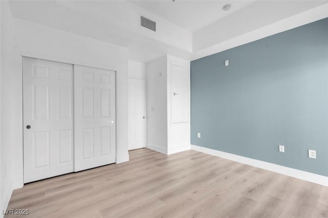 75 E Agate Ave Unit 206, Las Vegas, NV 89123 - unfurnished bedroom featuring wood finished floors and a closet