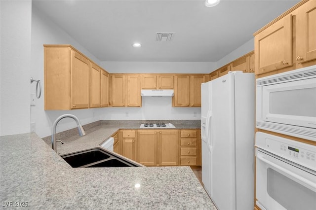 75 E Agate Ave Unit 206, Las Vegas, NV 89123 - kitchen with white appliances, under cabinet range hood, light brown cabinetry, and recessed lighting