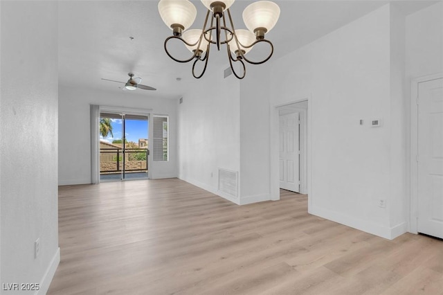 75 E Agate Ave Unit 206, Las Vegas, NV 89123 - unfurnished room with light wood finished floors, a chandelier, and ceiling fan