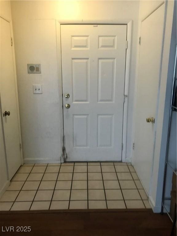 3150 Soft Breezes Dr Unit 1167, Las Vegas, NV 89128 - doorway to outside with light tile patterned floors and baseboards