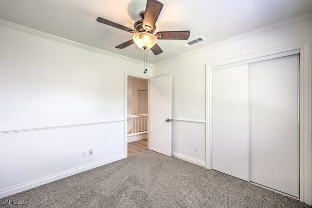 2501 Muirfield Ave, Henderson, NV 89074 - unfurnished bedroom with crown molding, carpet flooring, a closet, and a ceiling fan