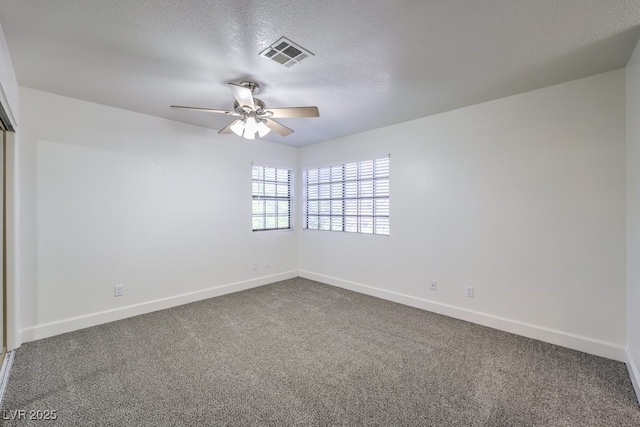 2501 Muirfield Ave, Henderson, NV 89074 - unfurnished room with a ceiling fan, dark colored carpet, and a textured ceiling