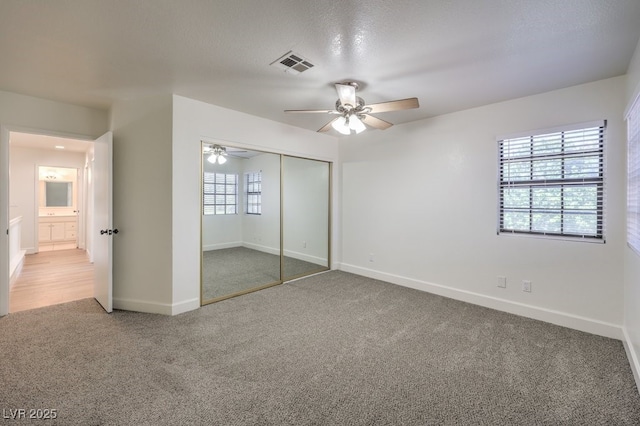 2501 Muirfield Ave, Henderson, NV 89074 - unfurnished bedroom featuring carpet flooring, a closet, and a ceiling fan
