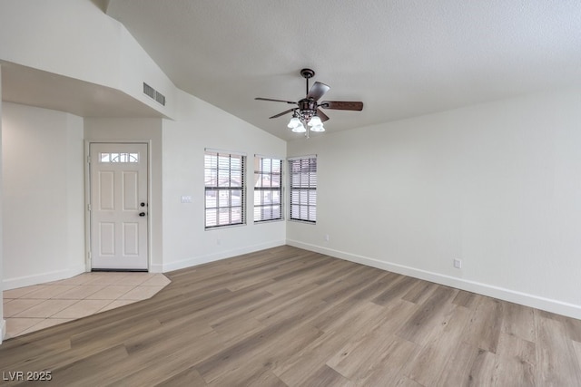 2501 Muirfield Ave, Henderson, NV 89074 - entrance foyer with a ceiling fan, wood finished floors, lofted ceiling, and a textured ceiling