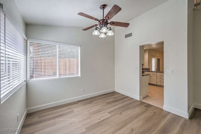 2501 Muirfield Ave, Henderson, NV 89074 - spare room featuring ceiling fan, light wood-style flooring, and vaulted ceiling