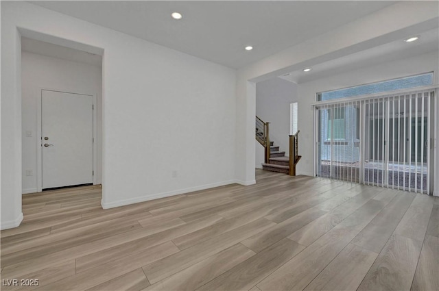 629 Soaring Wings Ave, Las Vegas, NV 89183 - spare room featuring light wood-style flooring, stairway, and recessed lighting