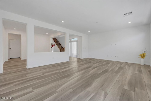 629 Soaring Wings Ave, Las Vegas, NV 89183 - unfurnished living room with light wood finished floors and recessed lighting