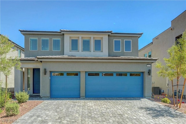 629 Soaring Wings Ave, Las Vegas, NV 89183 - prairie-style house with an attached garage, stucco siding, and decorative driveway