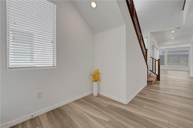 629 Soaring Wings Ave, Las Vegas, NV 89183 - unfurnished room featuring light wood-style floors, stairway, recessed lighting, and vaulted ceiling
