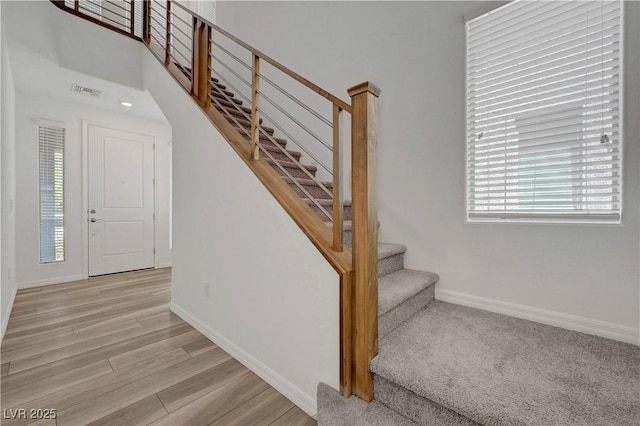 629 Soaring Wings Ave, Las Vegas, NV 89183 - stairway with healthy amount of natural light and wood finished floors