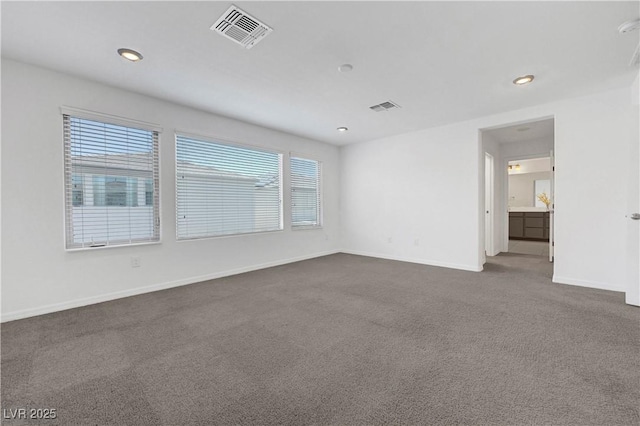 629 Soaring Wings Ave, Las Vegas, NV 89183 - spare room featuring dark colored carpet and recessed lighting