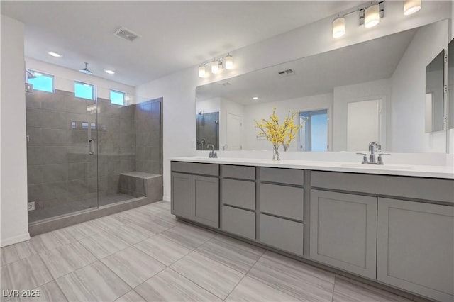 629 Soaring Wings Ave, Las Vegas, NV 89183 - bathroom with double vanity, a stall shower, and tile patterned flooring