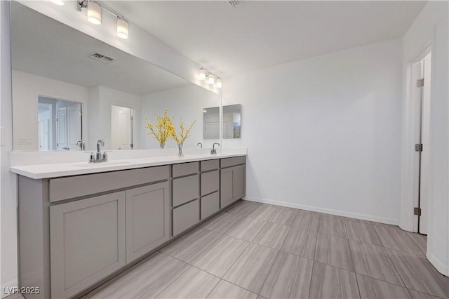 629 Soaring Wings Ave, Las Vegas, NV 89183 - bathroom with double vanity and baseboards