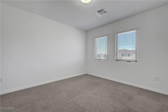 629 Soaring Wings Ave, Las Vegas, NV 89183 - spare room featuring dark carpet and baseboards