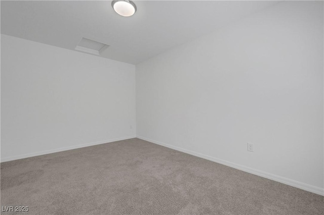 629 Soaring Wings Ave, Las Vegas, NV 89183 - carpeted spare room featuring baseboards and attic access