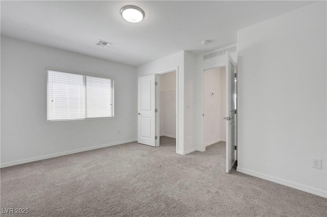 629 Soaring Wings Ave, Las Vegas, NV 89183 - unfurnished bedroom featuring carpet floors, a closet, and a spacious closet