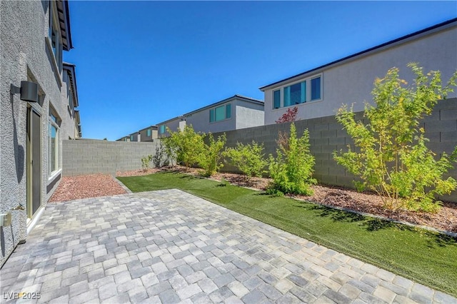 629 Soaring Wings Ave, Las Vegas, NV 89183 - fenced backyard with a patio area