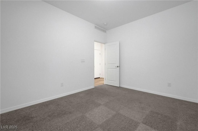 629 Soaring Wings Ave, Las Vegas, NV 89183 - unfurnished room with dark colored carpet and baseboards