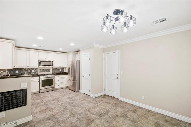 2385 Via Firenze, Henderson, NV 89044 - kitchen with stainless steel appliances, crown molding, tasteful backsplash, dark countertops, and recessed lighting