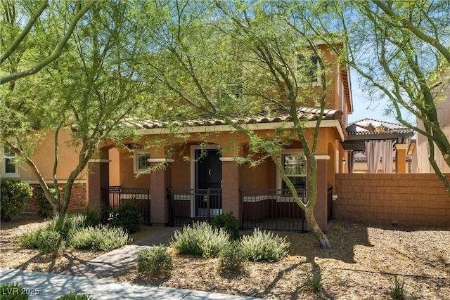 2385 Via Firenze, Henderson, NV 89044 - view of front of property with a fenced front yard, stucco siding, a gate, and covered porch