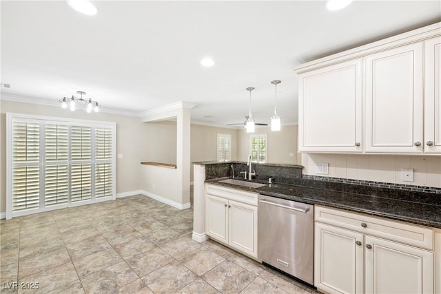 2385 Via Firenze, Henderson, NV 89044 - kitchen featuring stainless steel dishwasher, ornamental molding, dark stone counters, a ceiling fan, and a peninsula