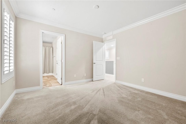 2385 Via Firenze, Henderson, NV 89044 - unfurnished bedroom featuring light colored carpet, crown molding, and connected bathroom
