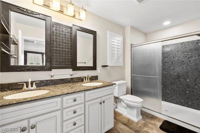 2385 Via Firenze, Henderson, NV 89044 - bathroom with double vanity, a stall shower, and tile patterned floors