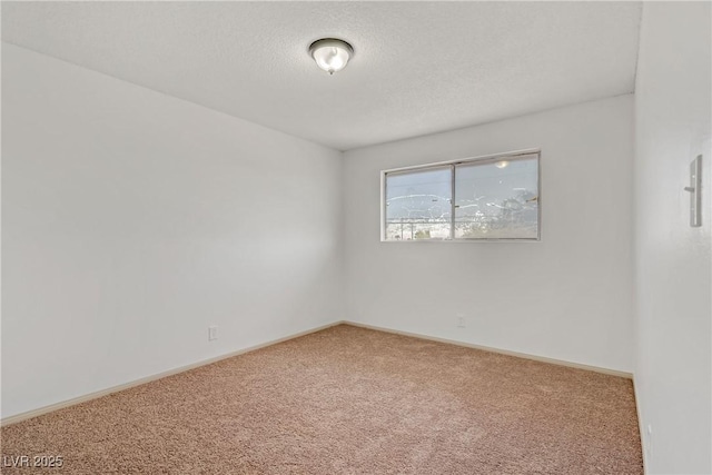 304 Orland St Unit 47, Las Vegas, NV 89107 - carpeted spare room with baseboards and a textured ceiling