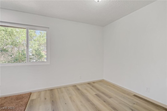 304 Orland St Unit 47, Las Vegas, NV 89107 - unfurnished room featuring light wood finished floors and a textured ceiling