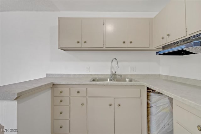 304 Orland St Unit 47, Las Vegas, NV 89107 - kitchen featuring under cabinet range hood and light countertops