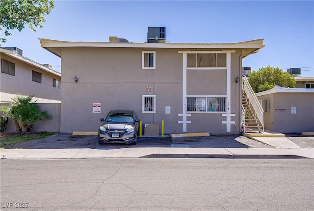 304 Orland St Unit 47, Las Vegas, NV 89107 - view of building exterior featuring stairs and uncovered parking