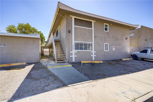 304 Orland St Unit 47, Las Vegas, NV 89107 - view of property exterior featuring stucco siding and stairs