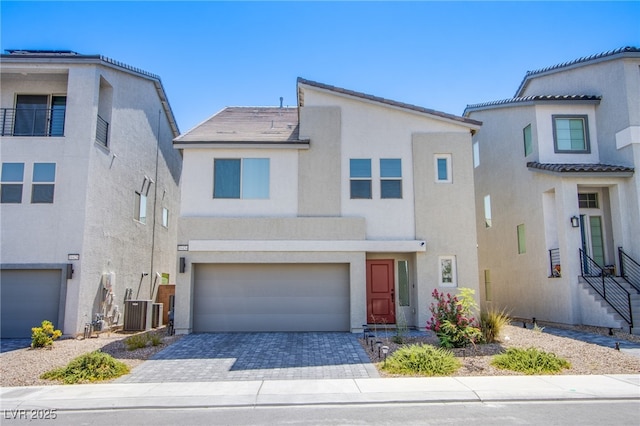 10434 Rose Palisade St, Las Vegas, NV 89141 - view of front of property featuring stucco siding, an attached garage, driveway, and a tiled roof