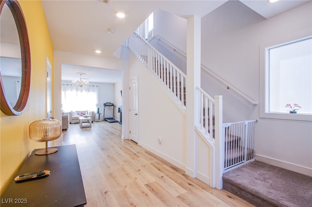 10434 Rose Palisade St, Las Vegas, NV 89141 - corridor featuring wood finished floors, a chandelier, recessed lighting, and stairway