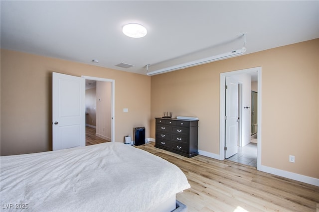 10434 Rose Palisade St, Las Vegas, NV 89141 - bedroom with light wood-style flooring and baseboards