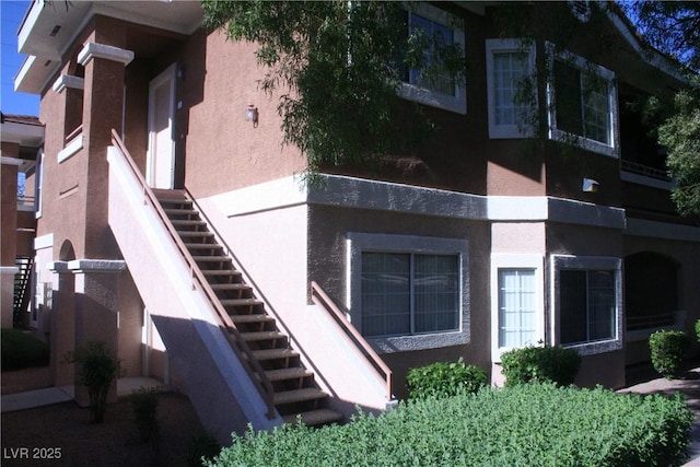 830 Carnegie St Unit 1011, Henderson, NV 89052 - view of side of home featuring stucco siding and stairs