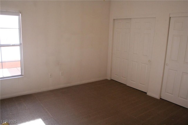 830 Carnegie St Unit 1011, Henderson, NV 89052 - unfurnished bedroom featuring multiple windows and dark carpet