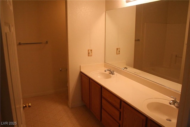 830 Carnegie St Unit 1011, Henderson, NV 89052 - bathroom with double vanity and baseboards