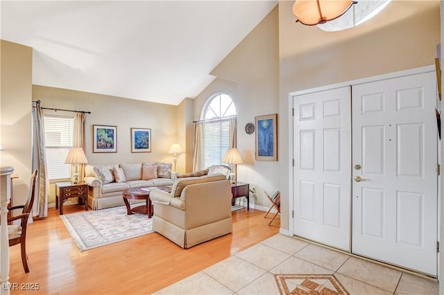 8416 Dry Cliff Cir, Las Vegas, NV 89128 - living area with high vaulted ceiling and light tile patterned flooring