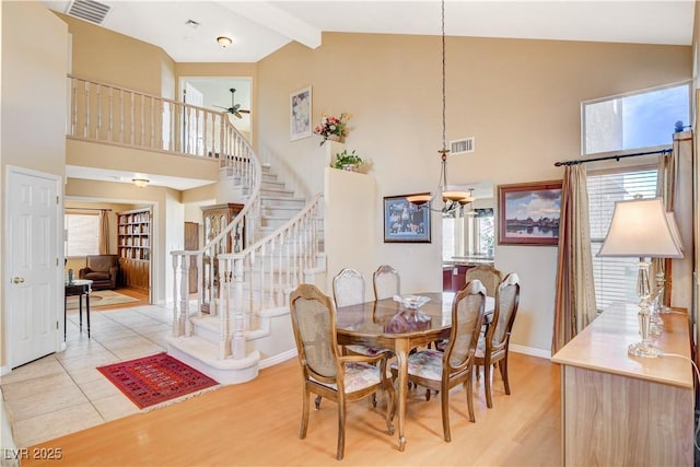 8416 Dry Cliff Cir, Las Vegas, NV 89128 - dining area featuring stairway, high vaulted ceiling, light wood-type flooring, beam ceiling, and a ceiling fan