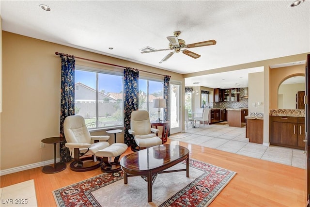 8416 Dry Cliff Cir, Las Vegas, NV 89128 - living area with light wood-style floors and ceiling fan