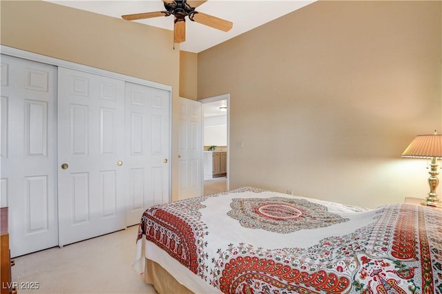 8416 Dry Cliff Cir, Las Vegas, NV 89128 - bedroom featuring light carpet, a closet, ceiling fan, and lofted ceiling