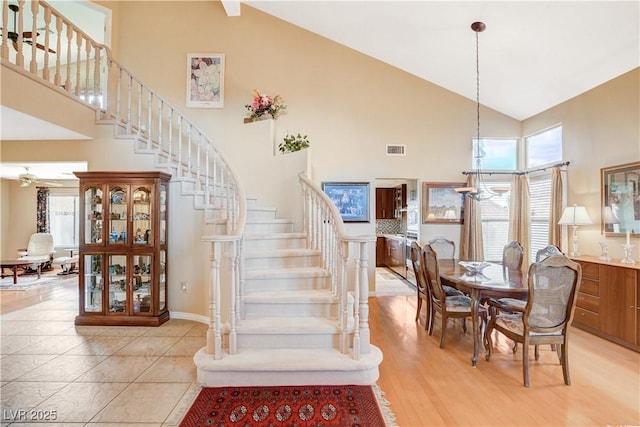 8416 Dry Cliff Cir, Las Vegas, NV 89128 - stairway with high vaulted ceiling and baseboards