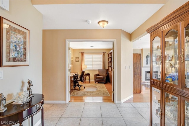 8416 Dry Cliff Cir, Las Vegas, NV 89128 - hall with light tile patterned flooring and a desk