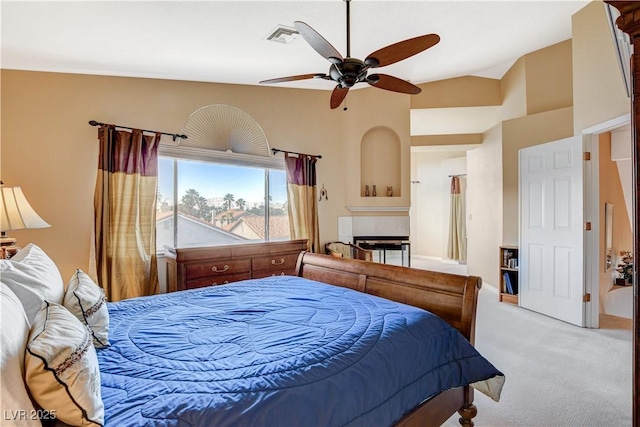 8416 Dry Cliff Cir, Las Vegas, NV 89128 - carpeted bedroom featuring a tiled fireplace, lofted ceiling, and ceiling fan