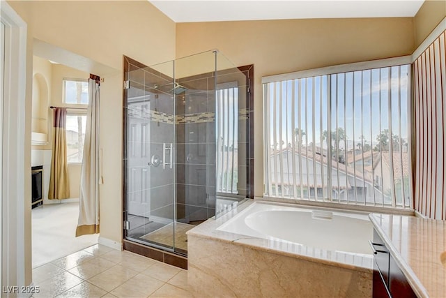 8416 Dry Cliff Cir, Las Vegas, NV 89128 - bathroom featuring a stall shower, a bath, tile patterned flooring, and vanity